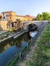 Wood mill and bridge on canal Martesana Milan. Italy