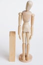 Wood model standing near wood Royalty Free Stock Photo