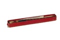 Wood musical instrument flute in red box on white background