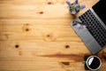 Wood office desk table with laptop computer, cup of black coffee and supplies. Top view with copy space, flat lay Royalty Free Stock Photo