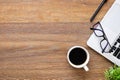 Wood office desk table with laptop computer, cup of coffee and supplies. Top view with copy space, flat lay Royalty Free Stock Photo