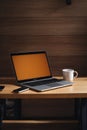 Wood office desk table with laptop computer, cup of coffee and supplies. Top view with copy space, flat lay. Royalty Free Stock Photo