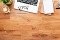 Wood office desk table with laptop computer, cup of coffee and supplies. Top view, flat lay Royalty Free Stock Photo