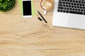 Wood office desk table with laptop computer, latte coffee, smartphone and supplies. Top view with copy space, flat lay Royalty Free Stock Photo