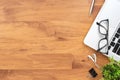 Wood office desk table with laptop computer and supplies. Top view, flat lay Royalty Free Stock Photo