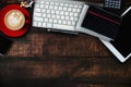 Wood office desk table with a lot of things tablet, laptop ,smartphone ,notepad and coffee cup notepad . Top view with copy space Royalty Free Stock Photo