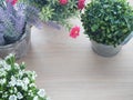 Wood office table with blank screen for text and variety flower Royalty Free Stock Photo