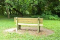 Wood park bench looking at the forest Royalty Free Stock Photo