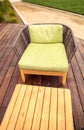 Wood patio lounge chairs with green cushions Royalty Free Stock Photo