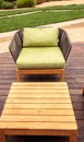 Wood patio lounge chairs with green cushions Royalty Free Stock Photo