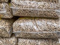 wood pellet bags stack, vertical shot Royalty Free Stock Photo