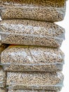 wood pellet bags stack, vertical shot Royalty Free Stock Photo