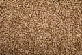 Wood pellet cat litter as background, top view Royalty Free Stock Photo