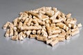 Wood pellets on a silver background. Toilets for Pets. Biofuels. The Cat Litter