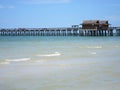 Wood pier by beach in Naples Florida Royalty Free Stock Photo