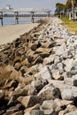 Wood Pier Beyond Rock Seawall Royalty Free Stock Photo