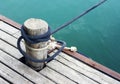 Wood pile with coiled rope on the dock Royalty Free Stock Photo