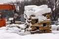 Wood Pile stack of firewood under the snow. Stack of cut wood under the snow Royalty Free Stock Photo