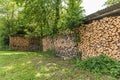 Wood pile, stacked and cut firewood, stored in an open shed Royalty Free Stock Photo