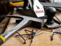 Wood plane, hammer, screw, nails, wood saw on oak board, Royalty Free Stock Photo