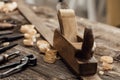 Wood planer on the carpenter`s workbench