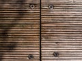 Wood plank texture background with for screws in the middle Royalty Free Stock Photo