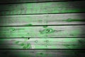 Wood planks, old green paint peeling off background texture Royalty Free Stock Photo