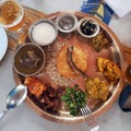 Wood plate with traditional Nepali food