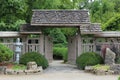 A wood privacy fence and arbor opening into a Japanese Garden at Rotary Botanic Gardens in Janesville