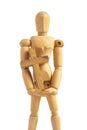 Wood Puppet Man Holding Simple Wood Cross. Adjustable Wood Doll Mannequin on iSolated White Background