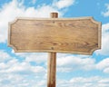 Wood road sign on sky background Royalty Free Stock Photo