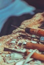 Wood sculptor tools on a table in workshop