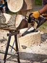 Wood sculptor using chainsaw Royalty Free Stock Photo