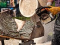 Wood sculptor using chainsaw Royalty Free Stock Photo