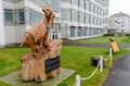 Wood sculpture of a goat outside the Venue Cymru