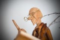 Wood sculpture, old man with glasses Royalty Free Stock Photo