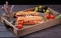 Wood serving or kitchen tray with traditional Spanish ham sandwiches