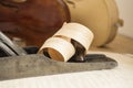 Wood shaving curled around carpentry plane