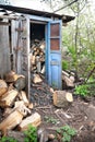 Wood shed with firewood. A pile of firewood. Lots of wood logs are stacked in the wood shed Royalty Free Stock Photo