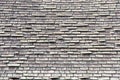 Close up on wood shingle roof in poor repair, falling apart Royalty Free Stock Photo