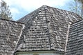 Wood shingle roof in poor state of repair Royalty Free Stock Photo