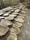 Wood shingles protect a low wall at Cranborne Ancient Technology Centre UK Royalty Free Stock Photo