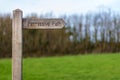 Wood sign marking the permissive path Royalty Free Stock Photo