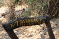 Wood sign in park of the victoria falls in zambia.