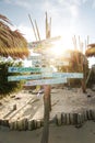 Wood sign of text at beautiful Thailand travel island `Koh Lipe` sand beach with sun flare and blue sky background landscape