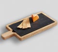 WoodWood & Slate Cheese Board with white background Royalty Free Stock Photo