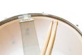 Wood snare drum and drumsticks isolated