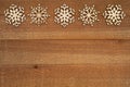 Wood snowflakes on weathered wood holiday background