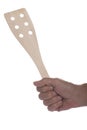 Wood spatula in hand on white