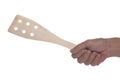 Wood spatule in hand on white